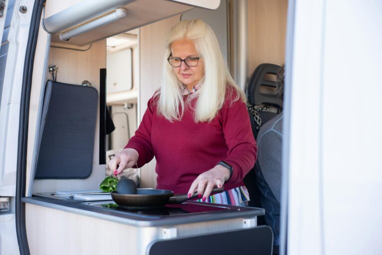 Woman in Red Long Sleeve Shirt Holding Black Tray